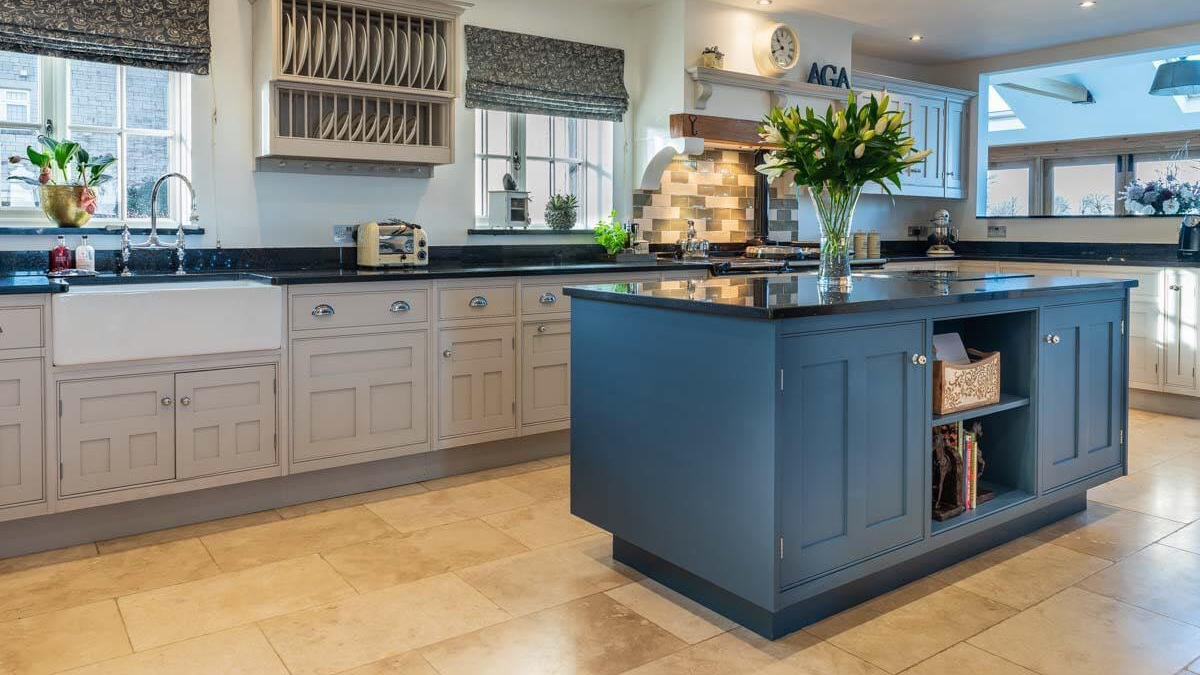 painted kitchen in wiltshire, Cornforth White on the main cabinets and the island in Farrow and Ball stiffkey blue